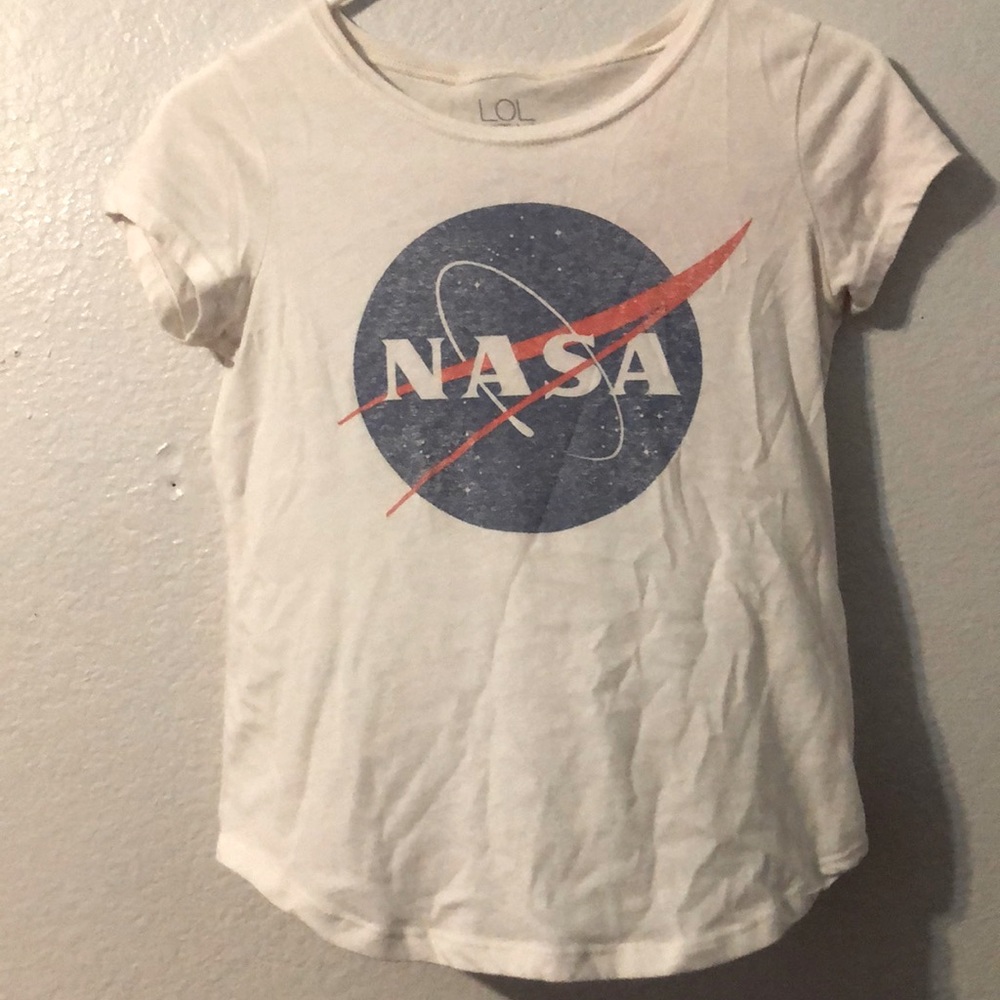 A white NASA shirt with stars